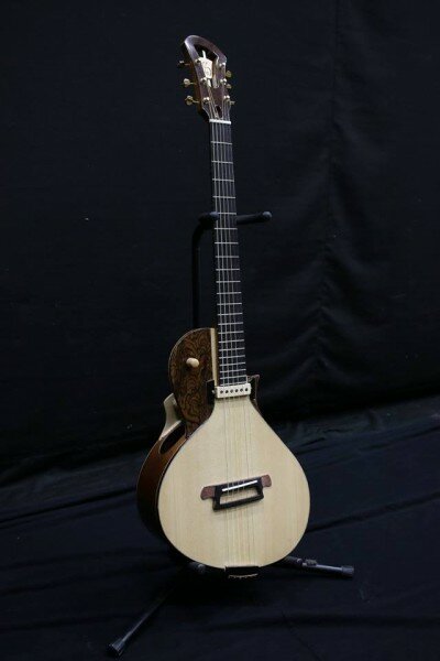 Savoncelli acoustic guitar facing right